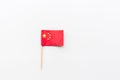 Mini Chinese flag lying on white background. National Flag China Day Concept Background, Flat Lay Style, Mockup, Overhead