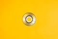 Mini compact disc on yellow background. copy space