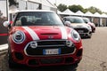 Mini cooper car front view red hood and cars aligned