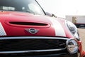 Mini cooper car hood close up front view of red hood and brand logo Royalty Free Stock Photo