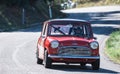 Mini coopert in an uphill race in castellina in chianti for the chianti classico cup,