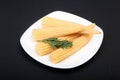 Mini Corn cob preserved on plate black background. Royalty Free Stock Photo