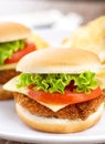 Mini Crispy Chicken Burger with Lettuce Tomato and Cheese. Royalty Free Stock Photo