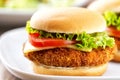 Mini Crispy Chicken Burger with Lettuce Tomato and Cheese. Royalty Free Stock Photo
