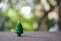 Mini cute Christmas trees on a blurred nature