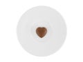 Mini dark heart shaped chocolate on white ceramic plate isolated on white background