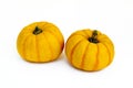 Mini decorative pumpkins on white background