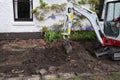 Mini digger in garden Royalty Free Stock Photo