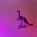 Mini dinosaurs in neon pink and blue.