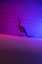Mini dinosaurs in neon pink and blue.