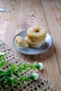 Mini donuts sugar on wooden table on styling Royalty Free Stock Photo