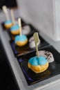 Mini Eclair Glazed with Blue Color Sugar served with Sweet Crush Taro and Black Sesame Royalty Free Stock Photo
