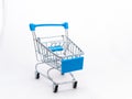 Mini empty grocery cart isolated on white background