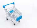 Mini empty grocery cart isolated on white background