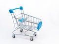 Mini empty grocery cart isolated on white background