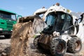 Mini excavator at construction site Royalty Free Stock Photo