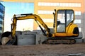 Mini excavator on a construction site Royalty Free Stock Photo