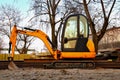 Mini excavator on a construction site Royalty Free Stock Photo