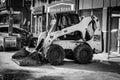 Mini Backhoe Excavator Loader In Side Street