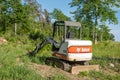 CROW WING CO - 8 JUN 2023: Bobcat mini excavator at future home site.