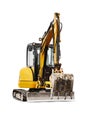 Mini excavator on a white isolated background. Compact construction equipment for earthworks. close-up. Element for design. Rental Royalty Free Stock Photo