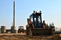 Mini excavator working on a construction site in the city. Royalty Free Stock Photo