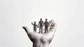 Mini figures family in hands on white background. Generative AI Royalty Free Stock Photo