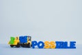 Mini forklift and bulldozer truck loading text IM changing impossible to possible text, business and finance concept.