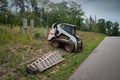 Mini front end loader with forklift attachment at construction site