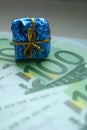 Mini gift on a euro banknote. The concept of free money, earning Royalty Free Stock Photo