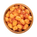 Mini gnocchi, boiled gnocchini dressed in tomato sauce, in a wooden bowl