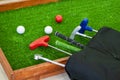 Mini-golf clubs and balls. Royalty Free Stock Photo