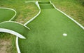 Mini golf lane with artificial turf and hole horizontal Royalty Free Stock Photo
