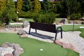 Mini golf course, yellow mini golf ball. Royalty Free Stock Photo