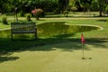 Mini golf field with red flag at the tropical island at Maldives Royalty Free Stock Photo