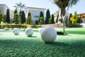 Mini golf scene with ball and club Royalty Free Stock Photo