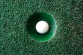 Mini golf scene with ball and hole Royalty Free Stock Photo