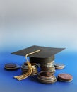 Grad cap and coins on blue Royalty Free Stock Photo