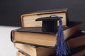 Mini graduation hat on stack of books