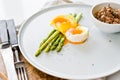 Mini grilled asparagus with egg and tuna. White background, side view. Royalty Free Stock Photo