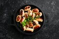 Mini grilled sausages on a frying pan. Barbecue. Meat menu. Royalty Free Stock Photo