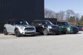 Mini Hardtop vehicles awaiting service at a dealership. Mini is a subsidiary of BMW