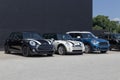 Mini Hardtop vehicles awaiting service at a dealership. Mini is a subsidiary of BMW