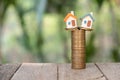 Miniature house models and stacked coins Investment risk Business growth Real estate investment and home mortgages, financial real