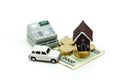 Mini House with stack of coins and car,Saving and investing money concept, Future financial planning concept.