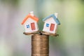 Mini house on stack of coins,Money and house,  Mortgage, Savings money for buy house and loan to business investment for real Royalty Free Stock Photo