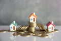 Mini house on stack of coins,Money and house,  Mortgage, Savings money for buy house and loan to business investment for real Royalty Free Stock Photo