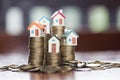 Mini house on stack of coins,Money and house, Real estate invest Royalty Free Stock Photo