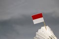Mini Indonesia flag stick on the white shuttlecock on the grey background