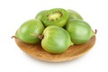 mini kiwi baby fruit or actinidia arguta in wooden bowl isolated on white background with full depth of field. Royalty Free Stock Photo